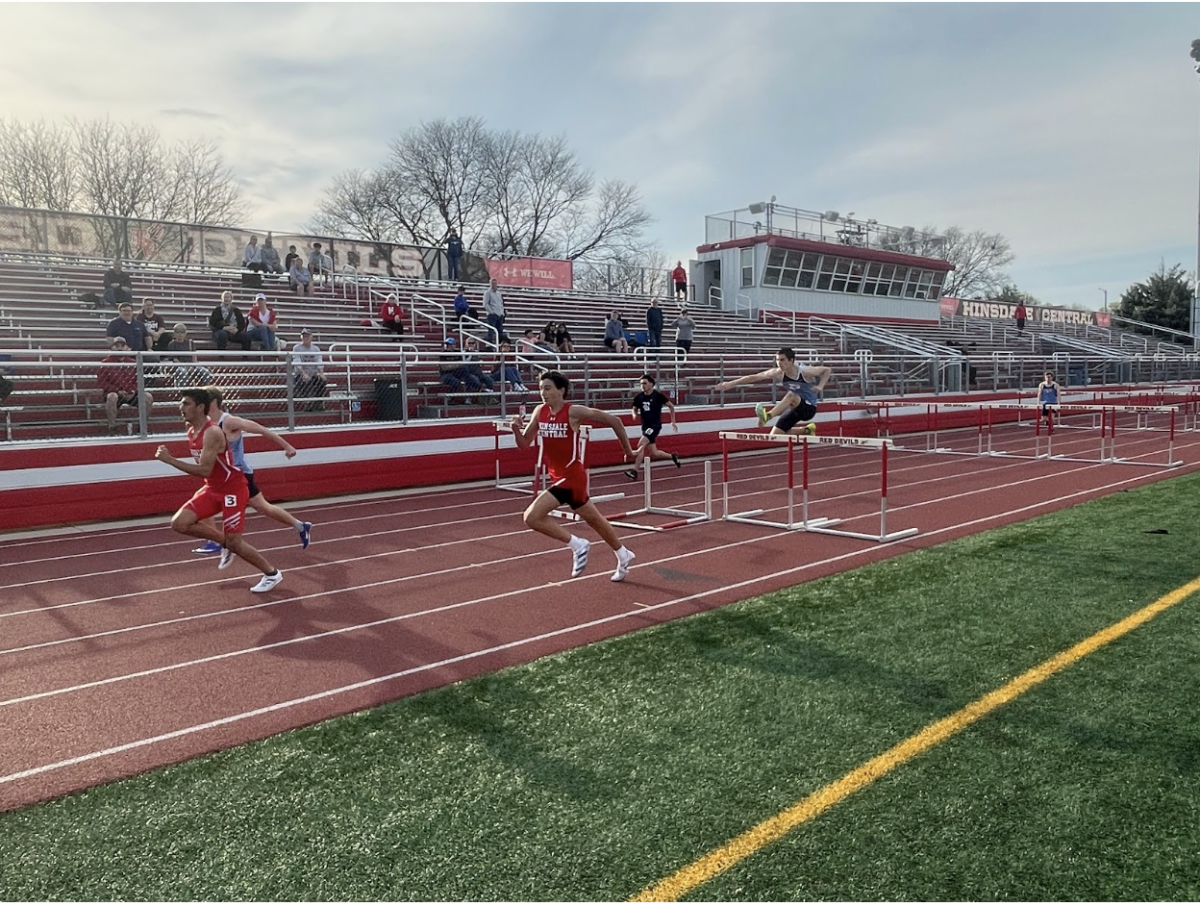 Hinsdale Central barely holds the lead in this 100m hurdle race as it comes to a near end.
